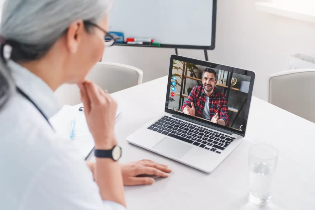 doctor telemedicine consultation with male patient utc